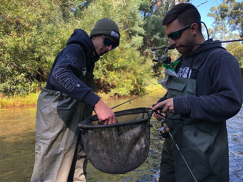 Trout fishing essentials - a good net, and a good mate